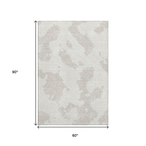 5' X 8' Ivory And Beige Abstract Washable Area Rug With UV Protection
