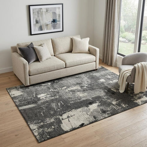5' X 8' Black And Ivory Abstract Washable Area Rug With UV Protection