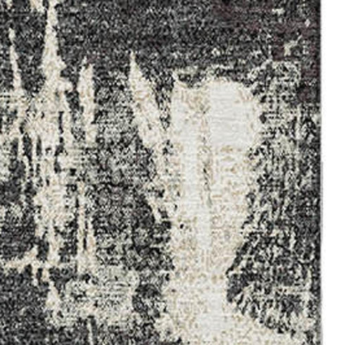 5' X 8' Black And Ivory Abstract Washable Area Rug With UV Protection