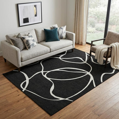 5' X 8' Black And Ivory Abstract Washable Area Rug With UV Protection
