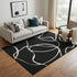 5' X 8' Black And Ivory Abstract Washable Area Rug With UV Protection