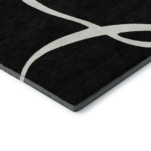 5' X 8' Black And Ivory Abstract Washable Area Rug With UV Protection