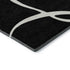 5' X 8' Black And Ivory Abstract Washable Area Rug With UV Protection