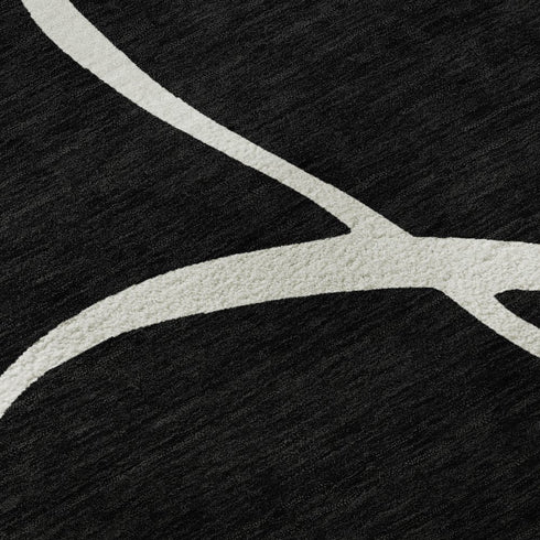 5' X 8' Black And Ivory Abstract Washable Area Rug With UV Protection
