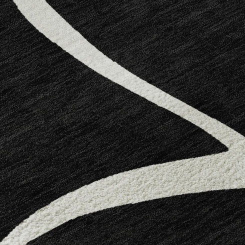 5' X 8' Black And Ivory Abstract Washable Area Rug With UV Protection