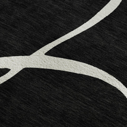 5' X 8' Black And Ivory Abstract Washable Area Rug With UV Protection
