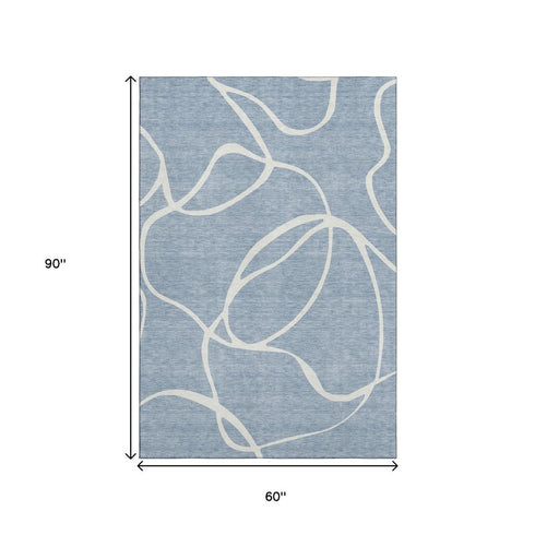 5' X 8' Denim Blue And Ivory Abstract Washable Area Rug With UV Protection