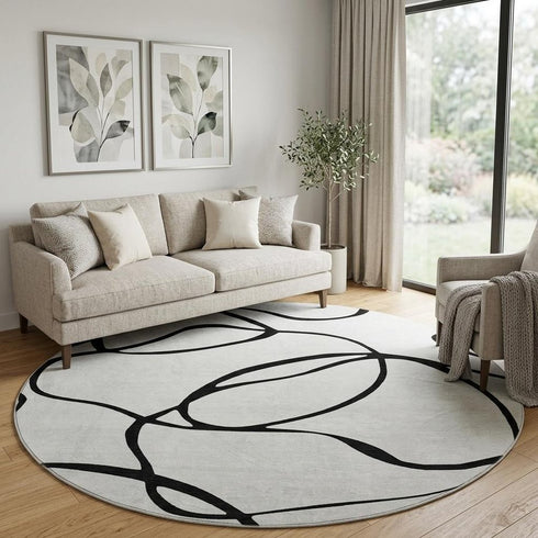 8' White And Black Abstract Washable Round Rug With UV Protection
