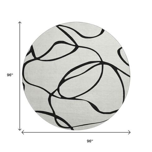 8' White And Black Abstract Washable Round Rug With UV Protection