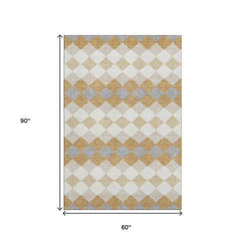 5' X 8' Gold Gray And Ivory Geometric Washable Area Rug With UV Protection