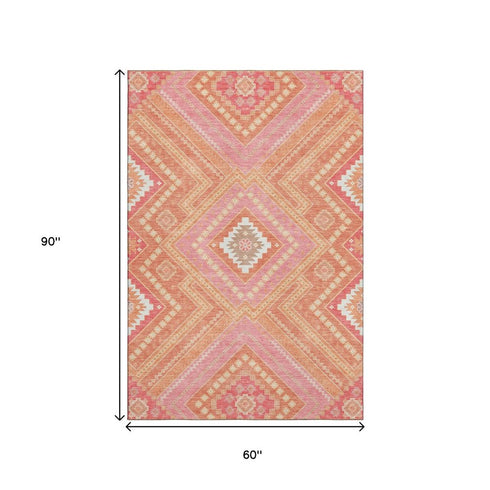 5' X 8' Coral Pink And Ivory Tribal Washable Area Rug With UV Protection