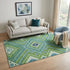 5' X 8' Lime Green Teal And Ivory Tribal Washable Area Rug With UV Protection