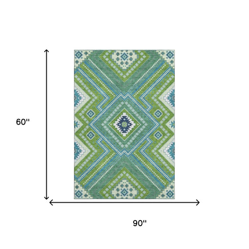 5' X 8' Lime Green Teal And Ivory Tribal Washable Area Rug With UV Protection