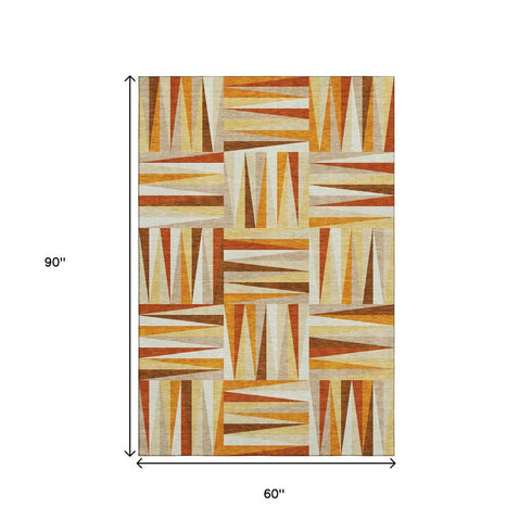 5' X 8' Orange Rust And Ivory Geometric Washable Area Rug With UV Protection