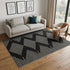 5' X 8' Black And Ivory Geometric Washable Area Rug With UV Protection