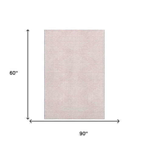 5' X 8' Pink And Ivory Geometric Washable Area Rug With UV Protection