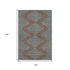5' X 8' Brown And Sky Blue Geometric Washable Area Rug With UV Protection