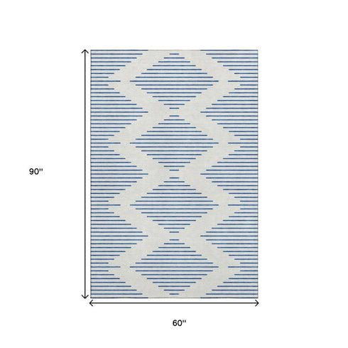5' X 8' Ivory And Navy Blue Geometric Washable Area Rug With UV Protection