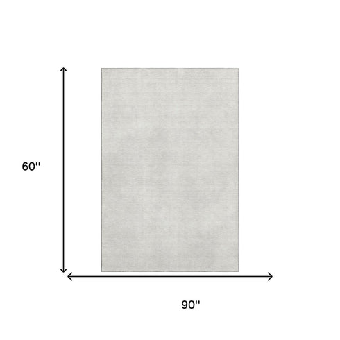 5' X 8' Ivory And Beige Abstract Washable Area Rug With UV Protection