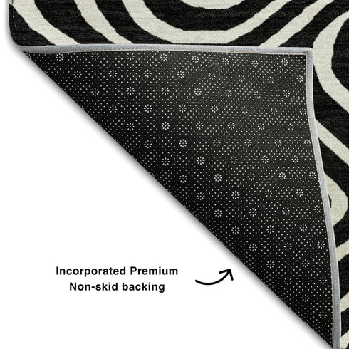 5' X 8' Black And Ivory Abstract Washable Area Rug With UV Protection