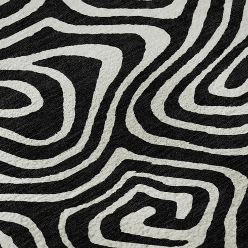 5' X 8' Black And Ivory Abstract Washable Area Rug With UV Protection