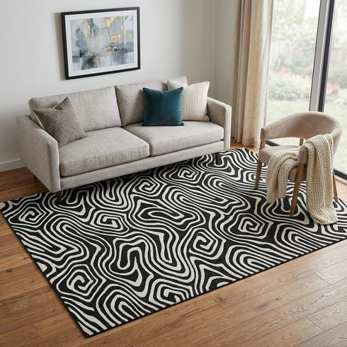 5' X 8' Black And Ivory Abstract Washable Area Rug With UV Protection