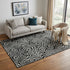 5' X 8' Black And Ivory Abstract Washable Area Rug With UV Protection