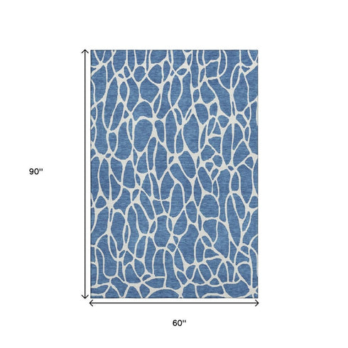 5' X 8' Blue And Ivory Geometric Washable Area Rug With UV Protection