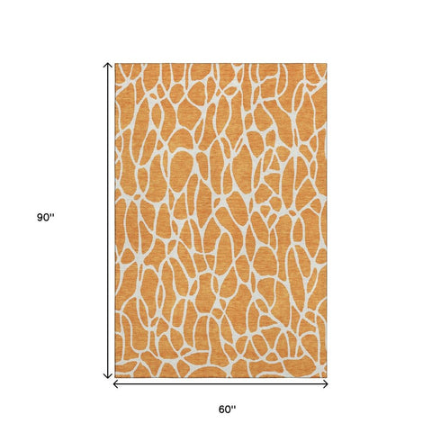 5' X 8' Orange And Ivory Geometric Washable Area Rug With UV Protection