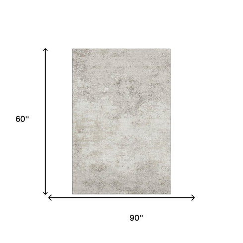 5' X 8' Ivory And Beige Abstract Washable Area Rug With UV Protection