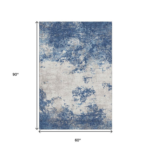 5' X 8' Navy Blue And Ivory Abstract Washable Area Rug With UV Protection