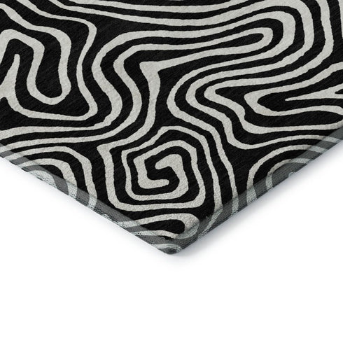 5' X 8' Black And Ivory Abstract Washable Area Rug With UV Protection