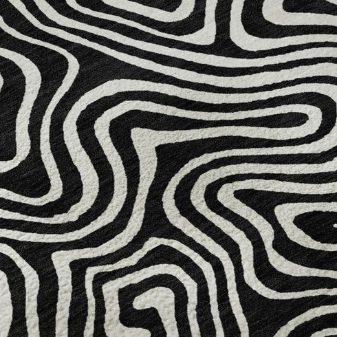 5' X 8' Black And Ivory Abstract Washable Area Rug With UV Protection