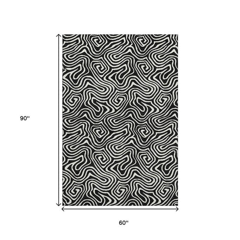 5' X 8' Black And Ivory Abstract Washable Area Rug With UV Protection