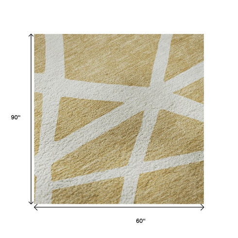 5' X 8' Gold And Ivory Geometric Washable Area Rug With UV Protection
