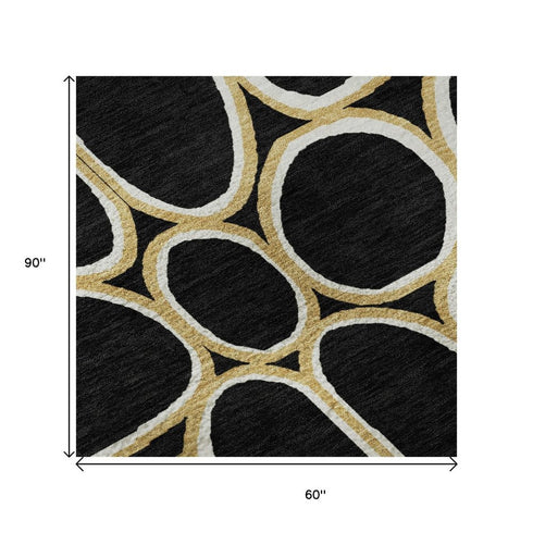 5' X 8' Black Ivory And Gold Geometric Washable Area Rug With UV Protection