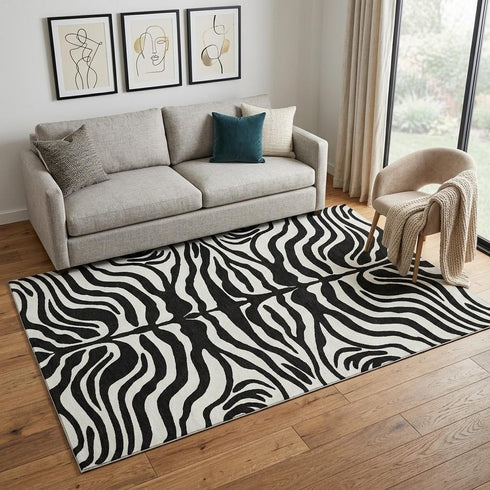 5' X 8' Black And Ivory Animal Print Washable Area Rug With UV Protection