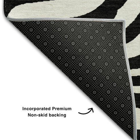 5' X 8' Black And Ivory Animal Print Washable Area Rug With UV Protection