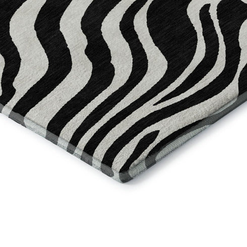 5' X 8' Black And Ivory Animal Print Washable Area Rug With UV Protection