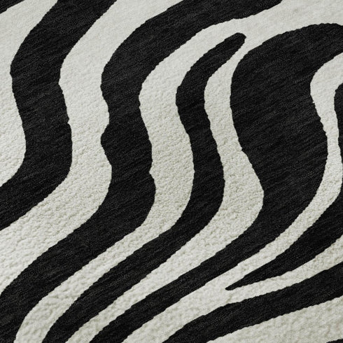 5' X 8' Black And Ivory Animal Print Washable Area Rug With UV Protection