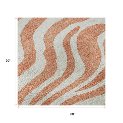 5' X 8' Coral And Ivory Animal Print Washable Area Rug With UV Protection