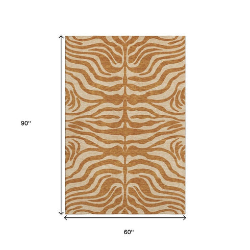 5' X 8' Rust And Beige Animal Print Washable Area Rug With UV Protection