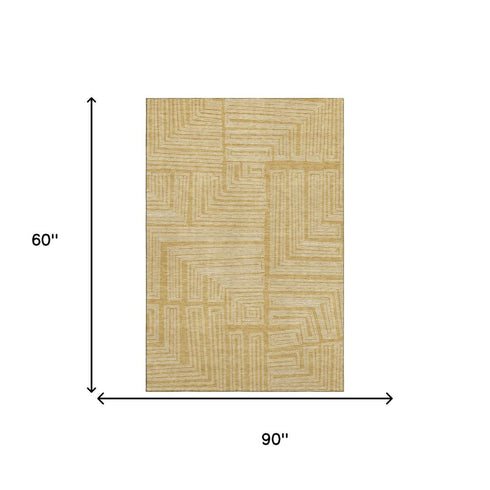 5' X 8' Gold And Ivory Geometric Washable Area Rug With UV Protection