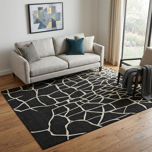 5' X 8' Black And Ivory Abstract Geometric Washable Area Rug With UV Protection