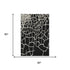 5' X 8' Black And Ivory Abstract Geometric Washable Area Rug With UV Protection