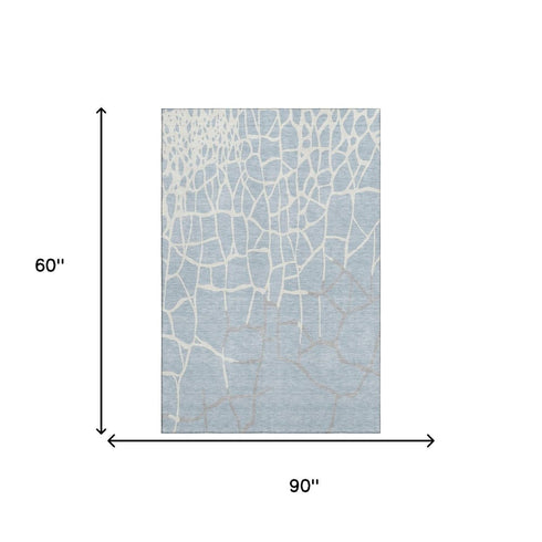 5' X 8' Sky Blue Ivory And Gray Abstract Geometric Washable Area Rug With UV Protection