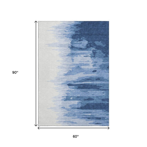 5' X 8' Navy Blue And Ivory Abstract Washable Area Rug With UV Protection