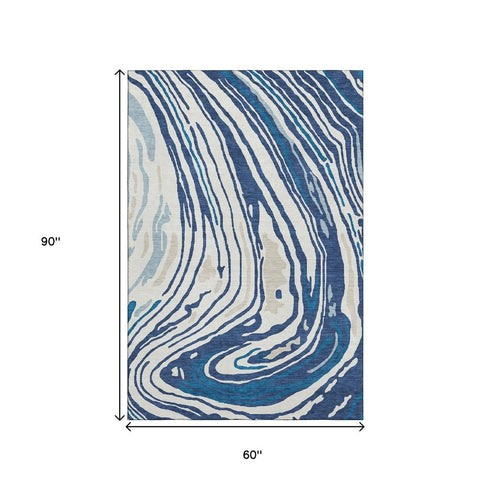 5' X 8' Navy Blue Ivory And Beige Abstract Washable Area Rug With UV Protection