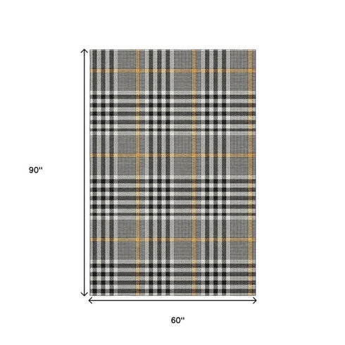 5' X 8' Black Ivory And Gold Plaid Washable Area Rug With UV Protection