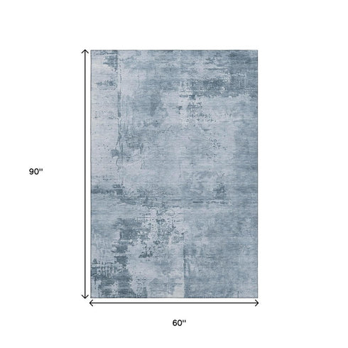5' X 8' Denim Blue And Ivory Abstract Washable Area Rug With UV Protection